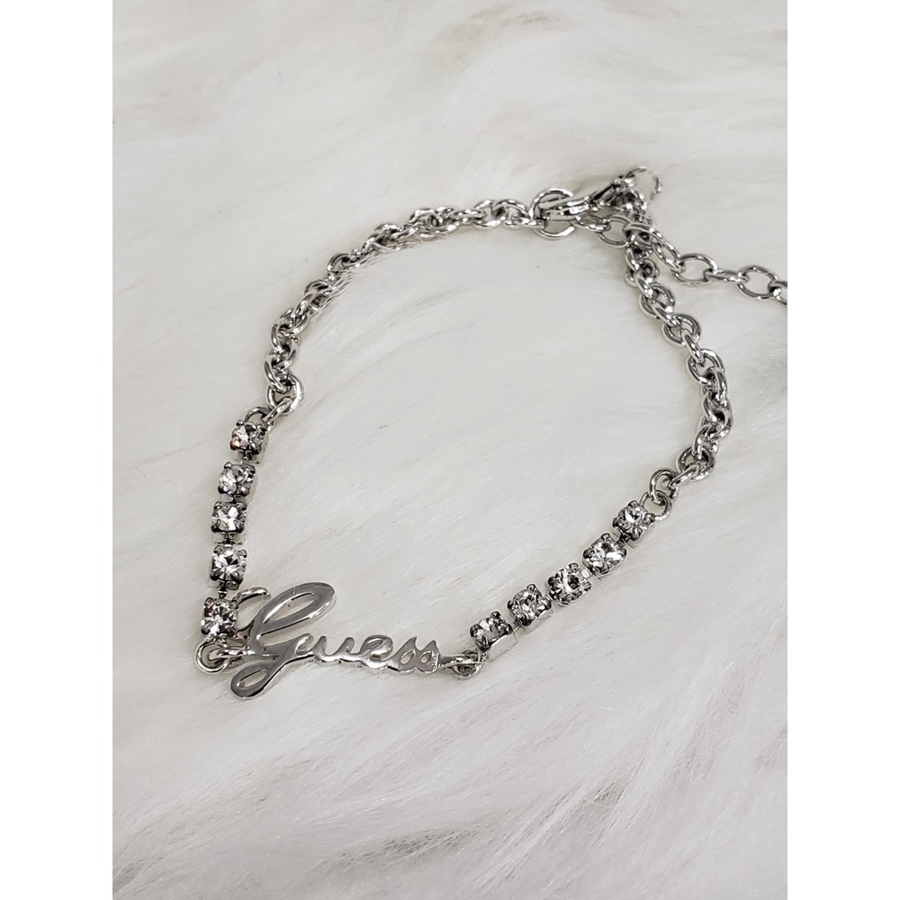 GUESS Clear Crystal Rhinestone Spell Out Logo Silver Tone Bracelet